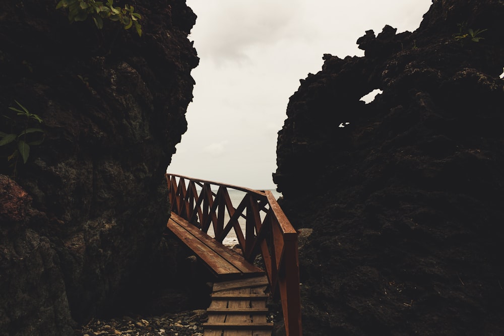 a wooden bridge over a river