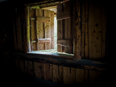 Interior view of a wooden frame house with natural light.