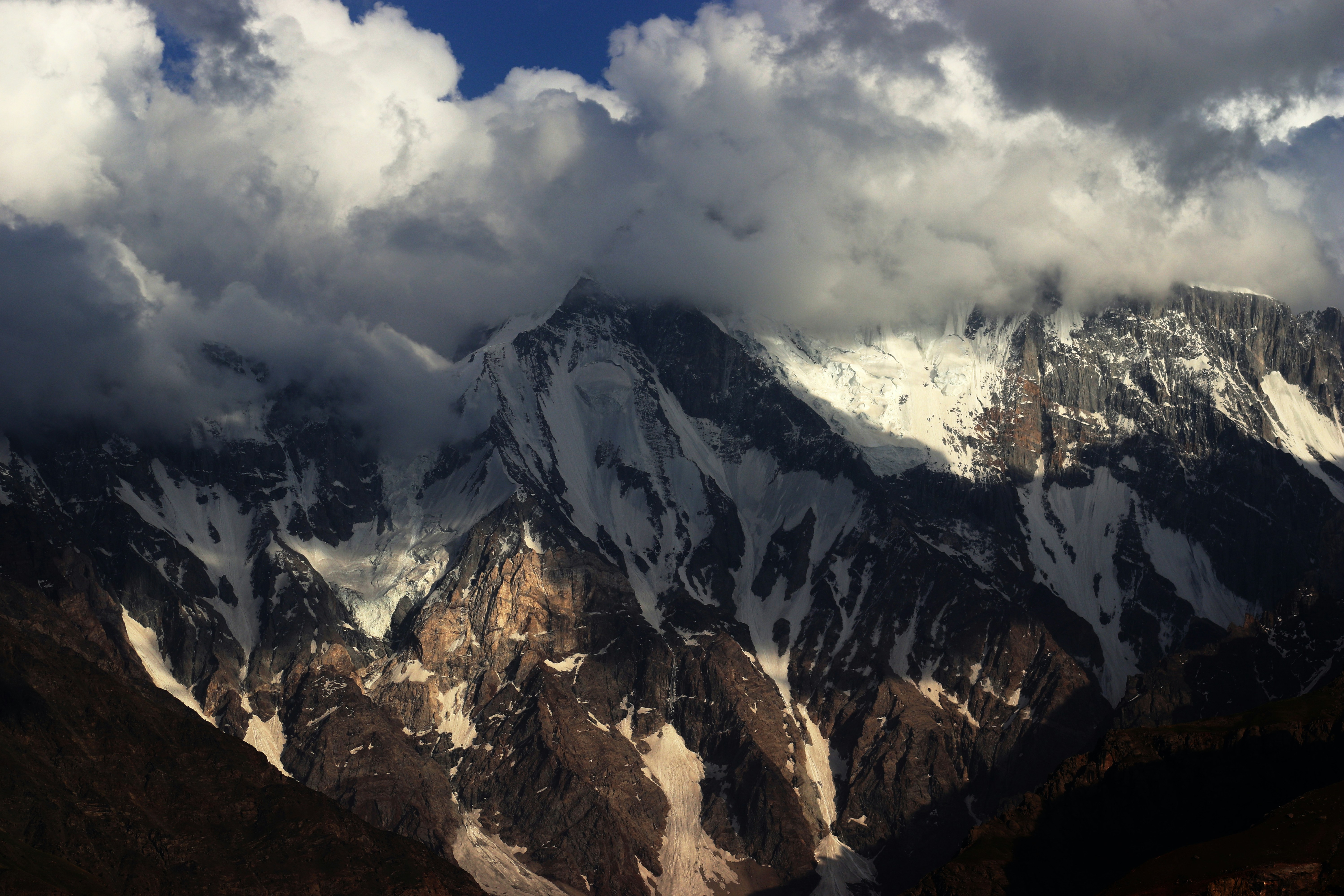a mountain range with clouds