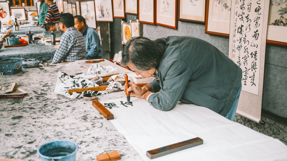 a person painting on a table