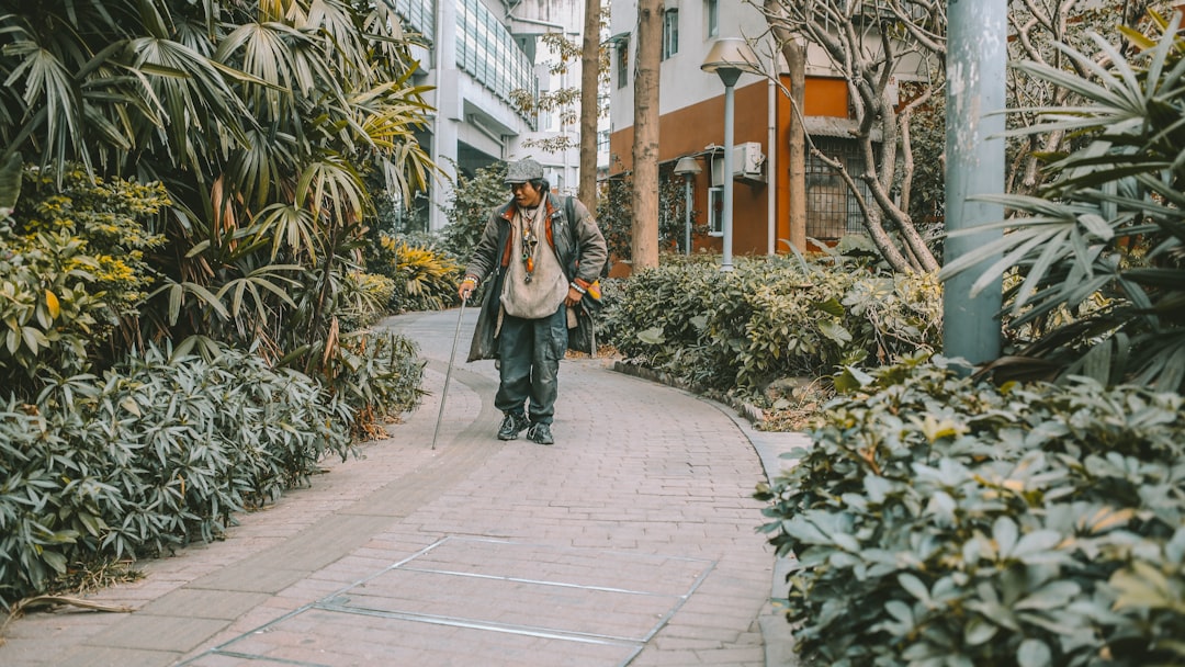 a person walking down a sidewalk,