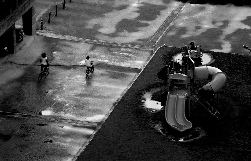 a group of people riding on a car in a flooded area