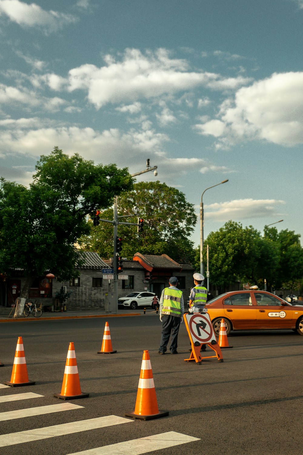 a group of workers stand in the middle of a street