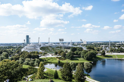 Wide shot of a tensile roof covering a large public plaza.