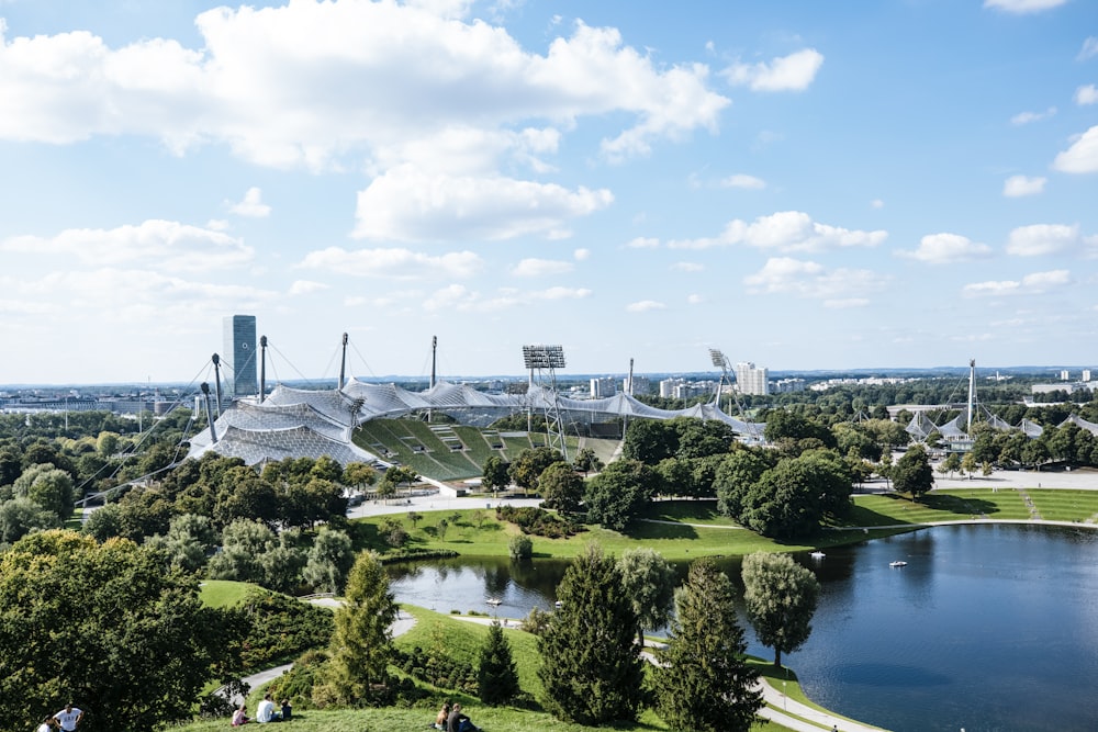 a large stadium with a river in front of it