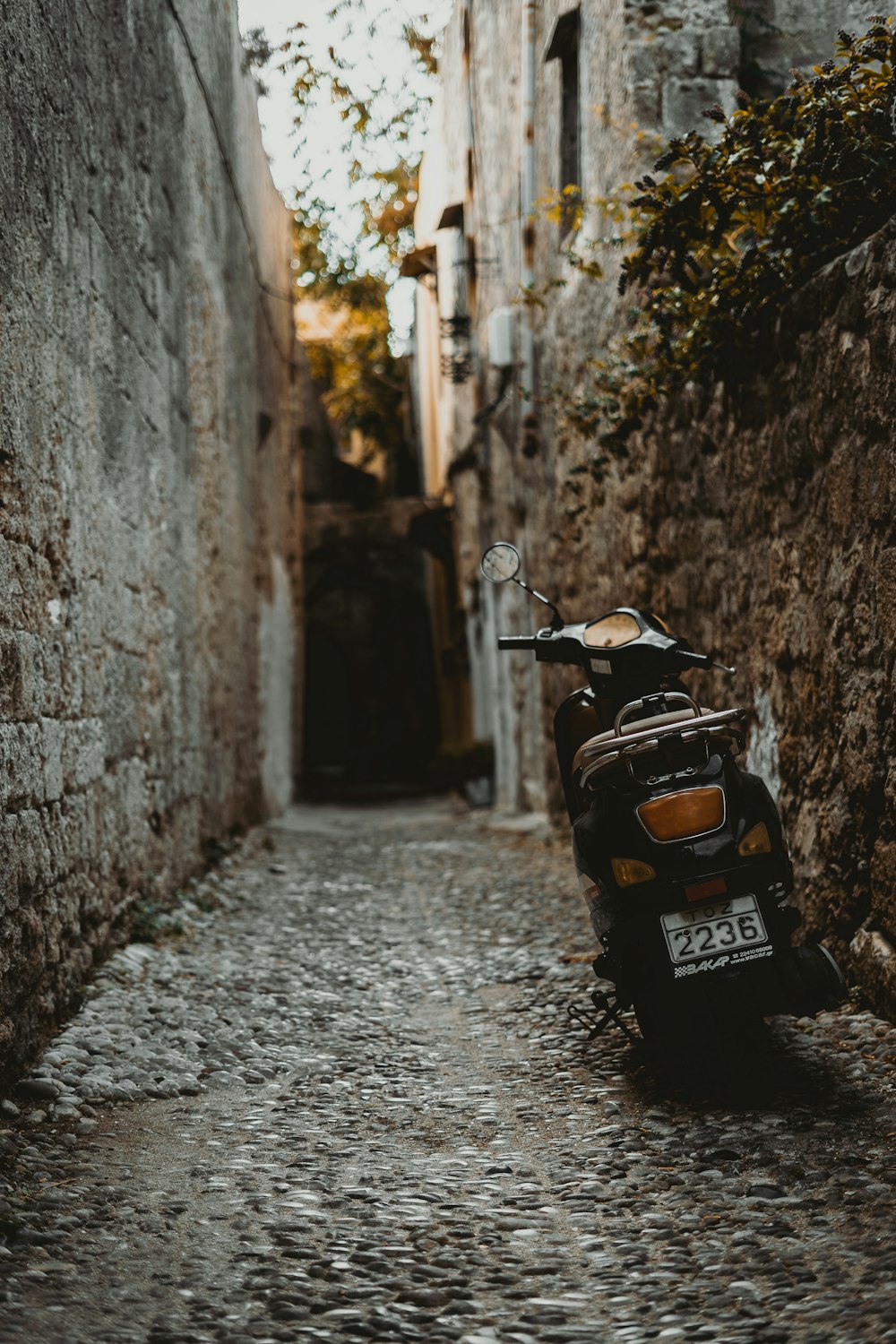 a motorcycle parked in an alley