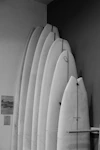 a couple of surfboards on a rack
