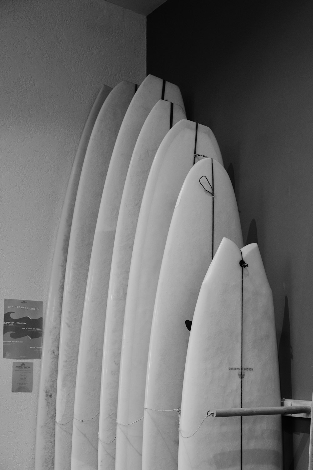 a couple of surfboards on a rack