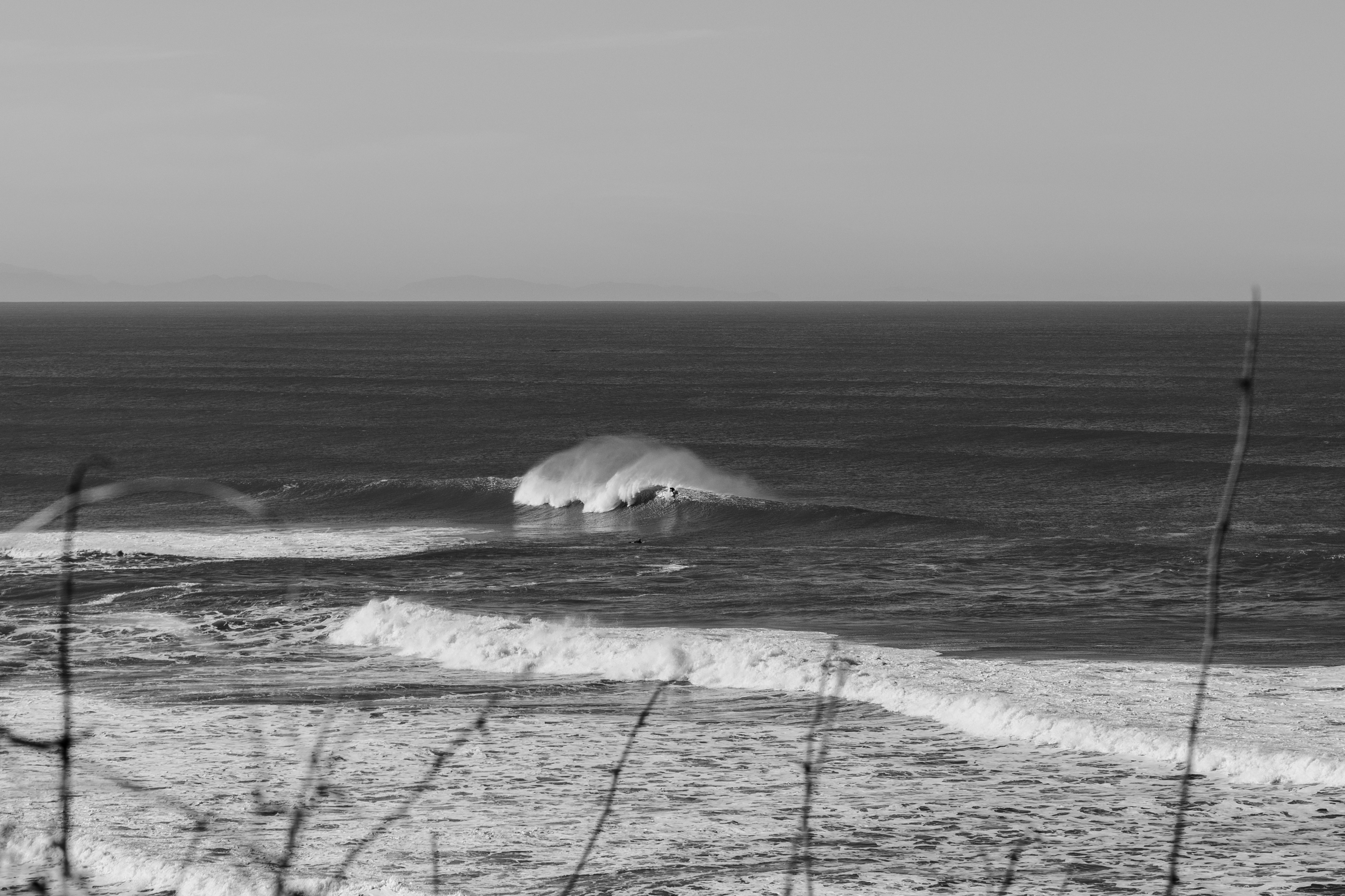 a beach with waves crashing