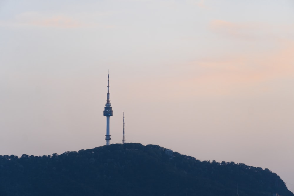 a tall tower on a hill