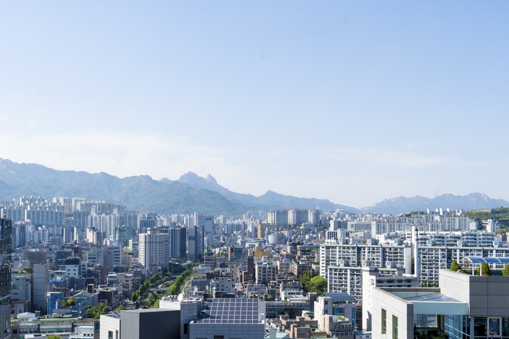 a city with mountains in the background