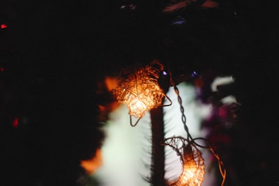 Festive Eid lantern hanging against a soft glowing backdrop.