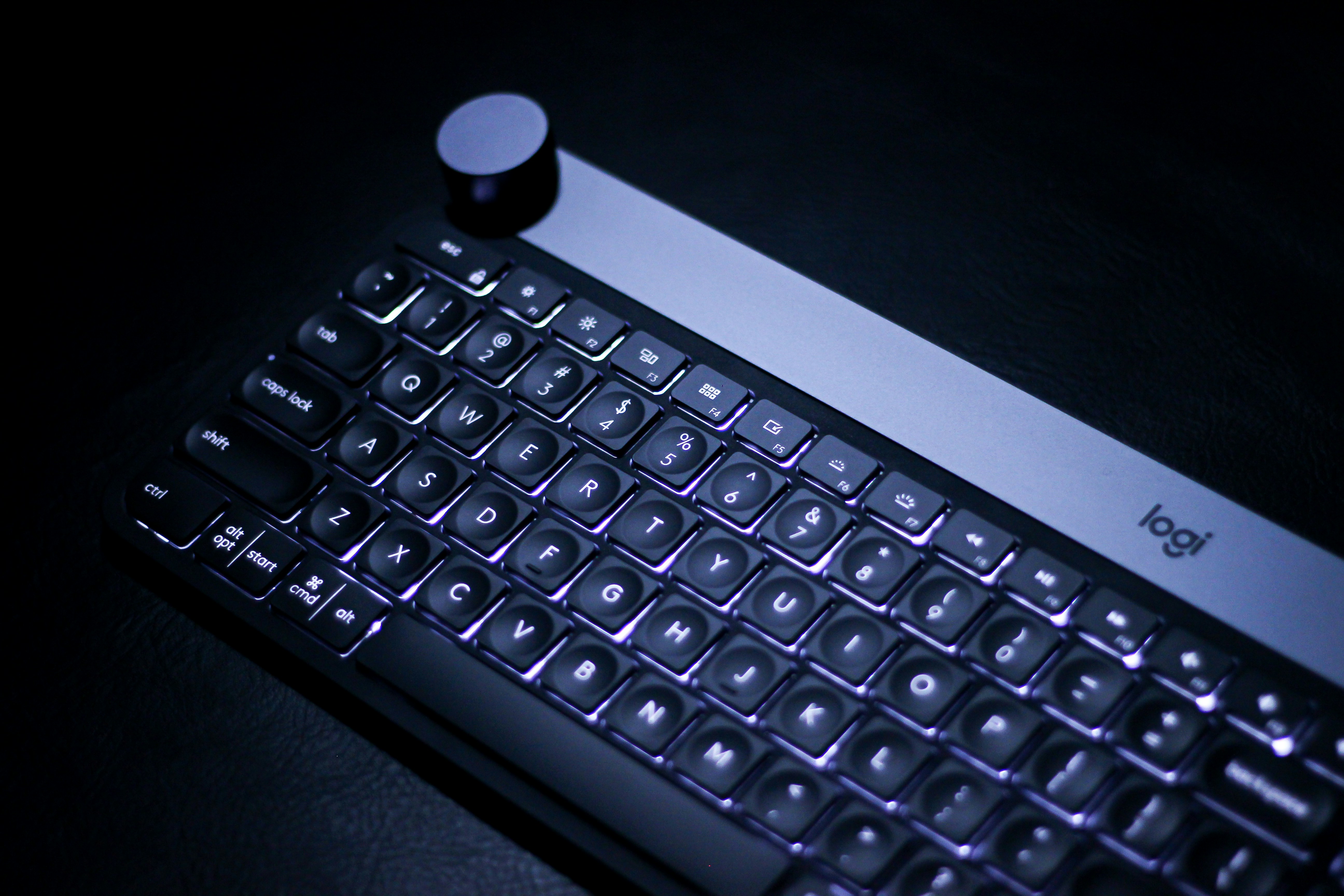 a black keyboard with a small white bottle on top