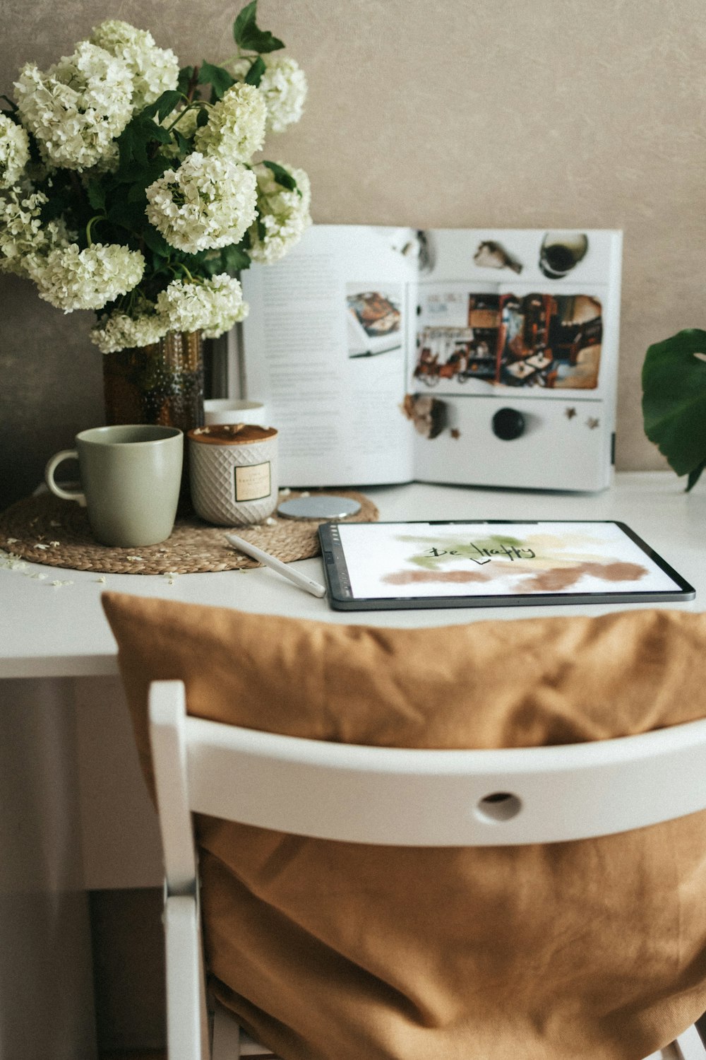 a table with a book and flowers