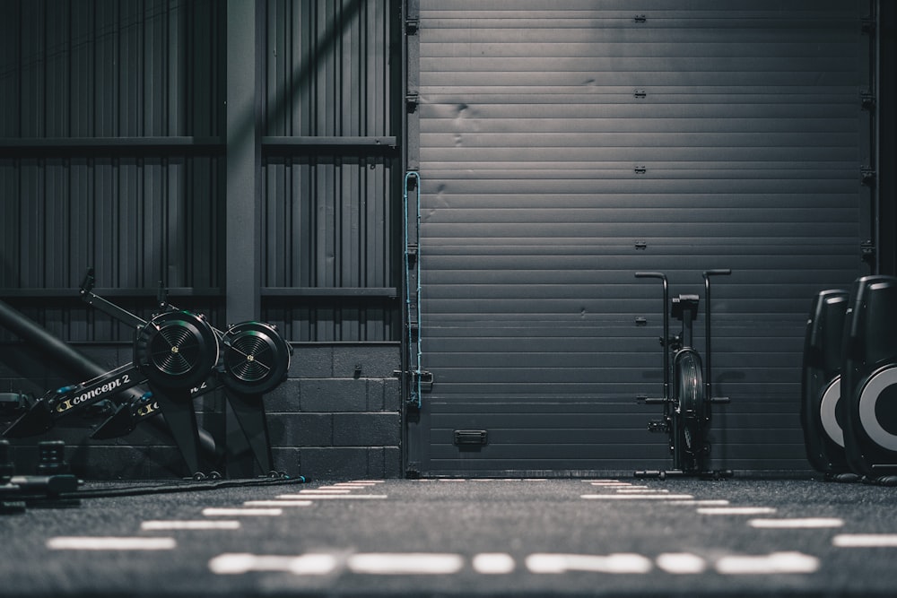 a bike parked in front of a garage door