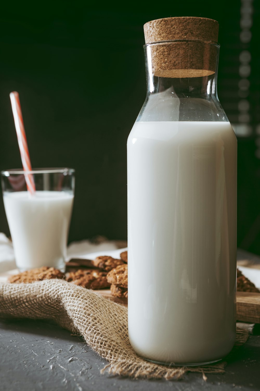 a bottle of milk and a glass of milk