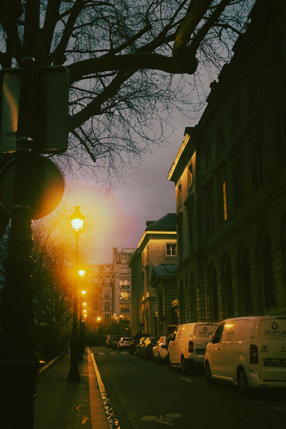 a street with cars and buildings on the side