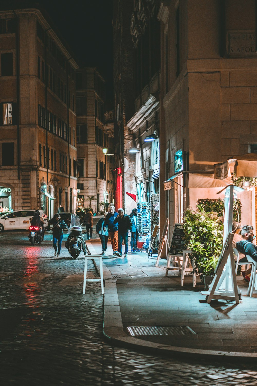 people walking on a sidewalk