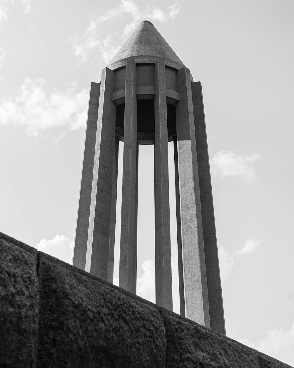 a large tall tower with a clock on the side of a building