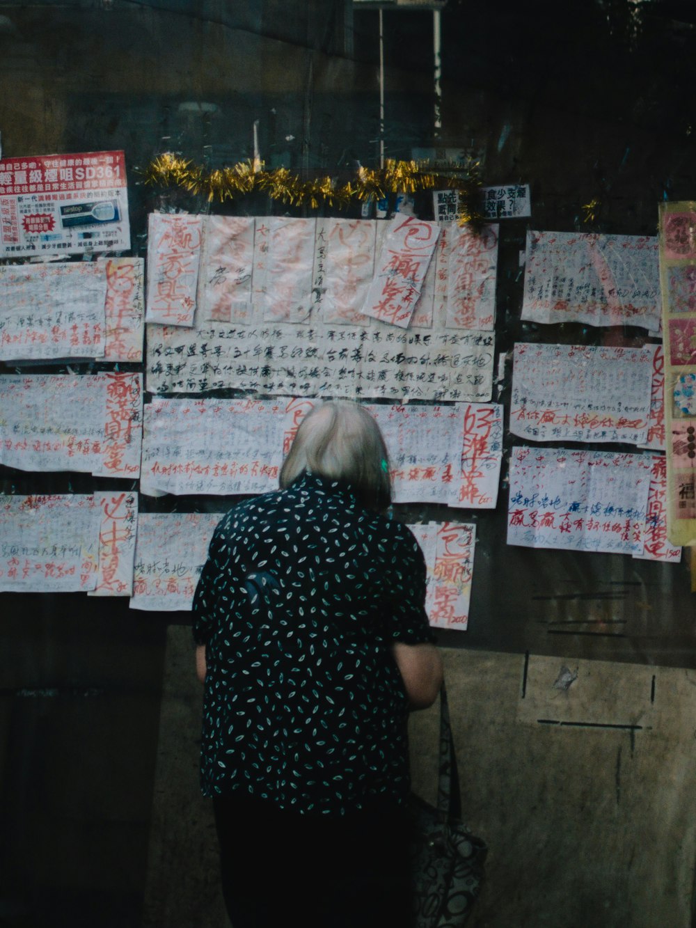 a person looking at a poster