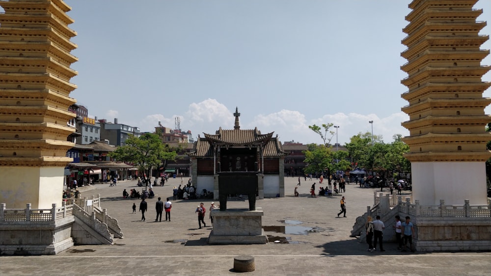a courtyard with people and buildings