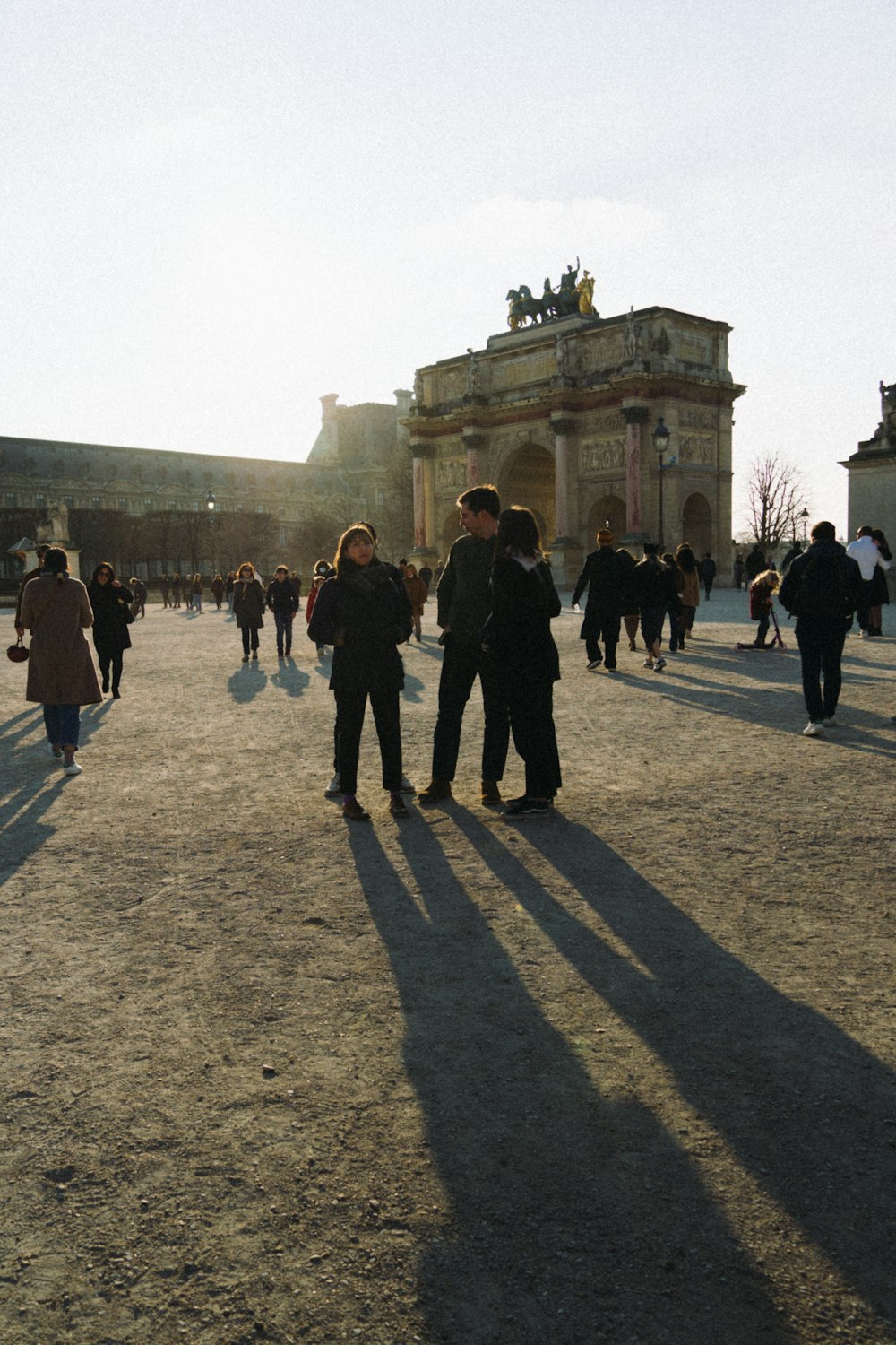 a group of people walking in front of a building