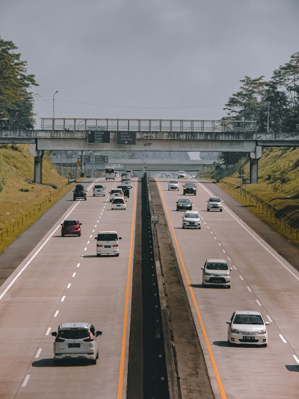 a highway with cars on it