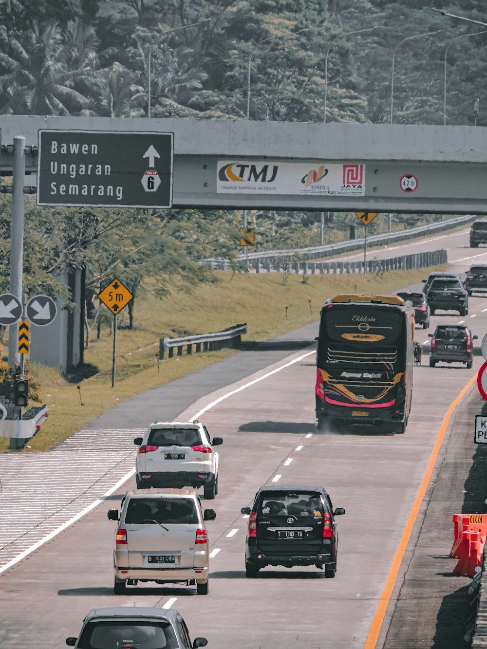 a highway with cars and a bus
