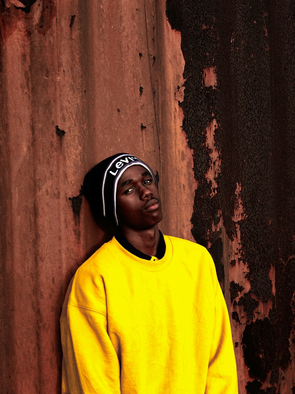 a man wearing a yellow shirt