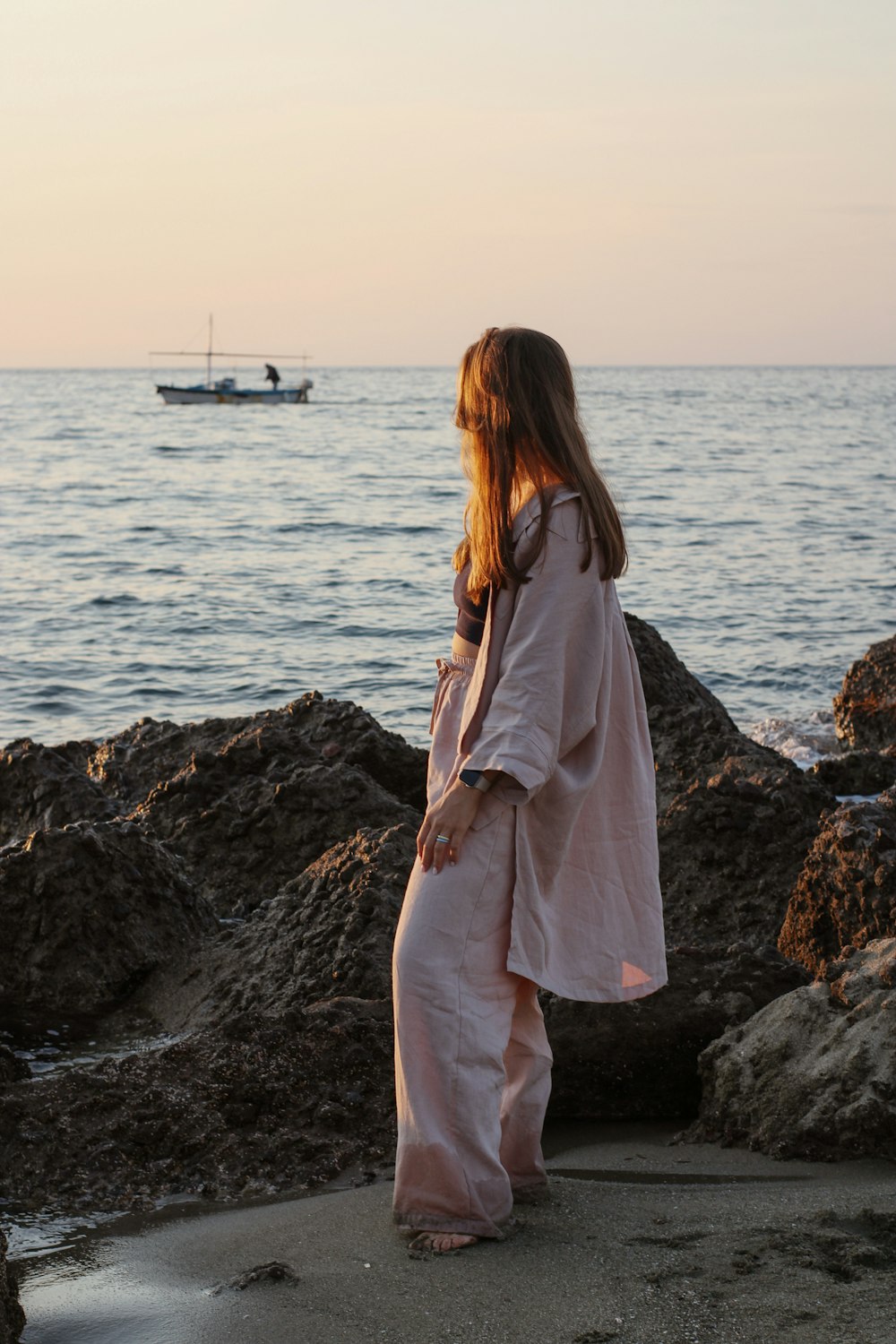 a person standing in front of a body of water