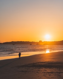 a person walking on a beach