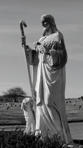 a statue of a person holding a sword