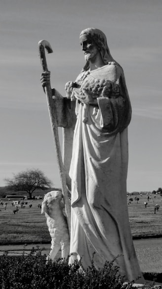 a statue of a person holding a sword