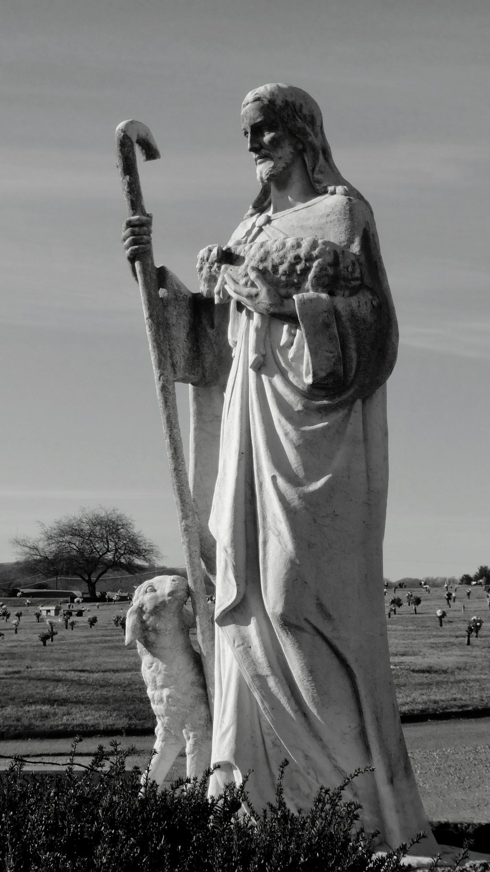 a statue of a person holding a sword