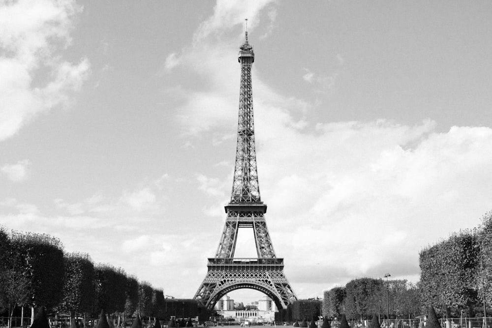 a large metal tower with Eiffel Tower in the background