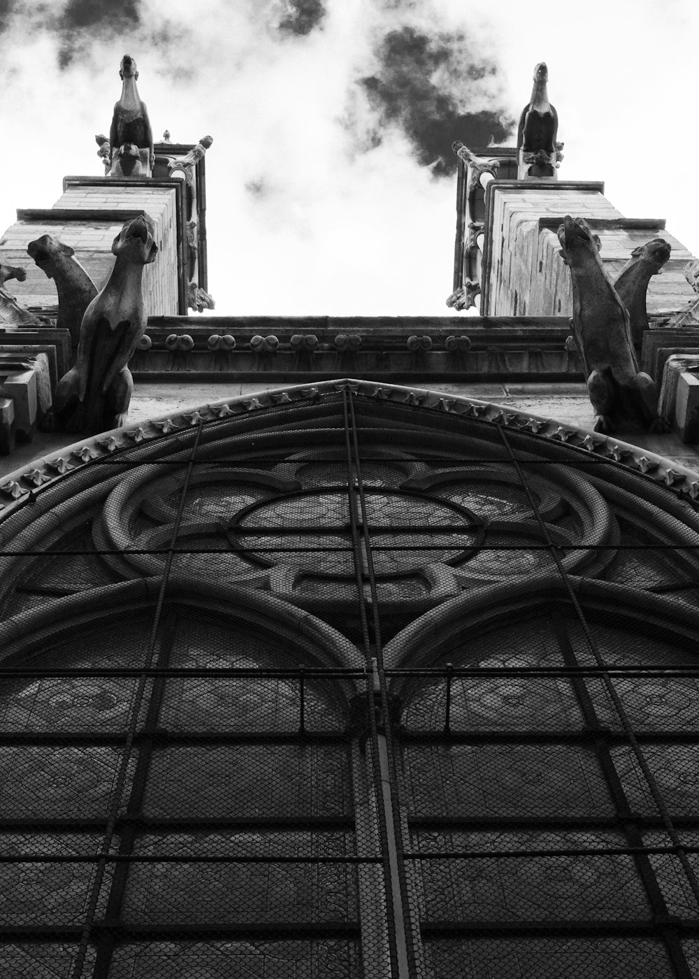 a group of statues on a roof