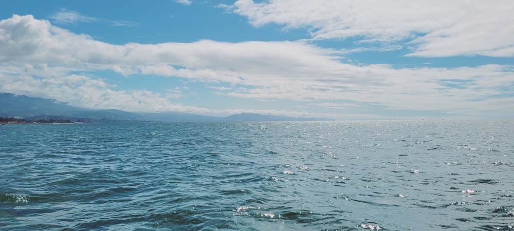 a body of water with land in the distance