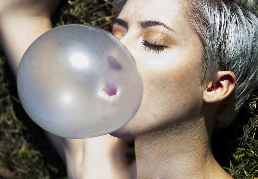 a man kissing a bubble