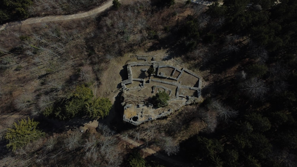 a stone structure in a field