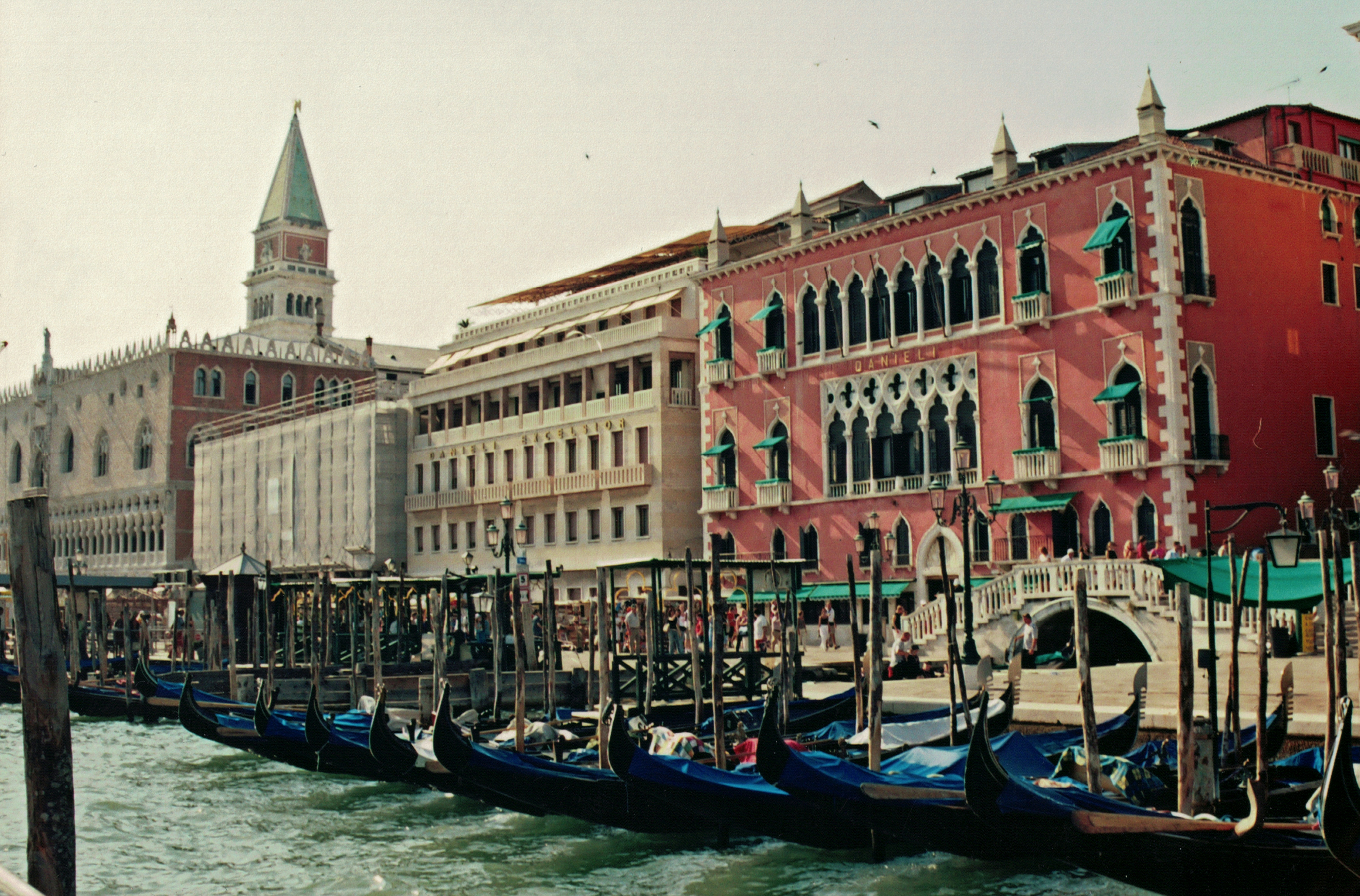 a canal with boats in it and buildings around it