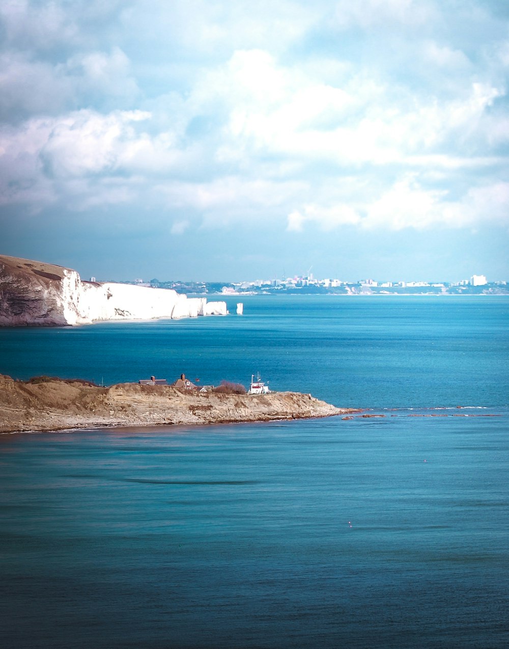 a body of water with land in the back