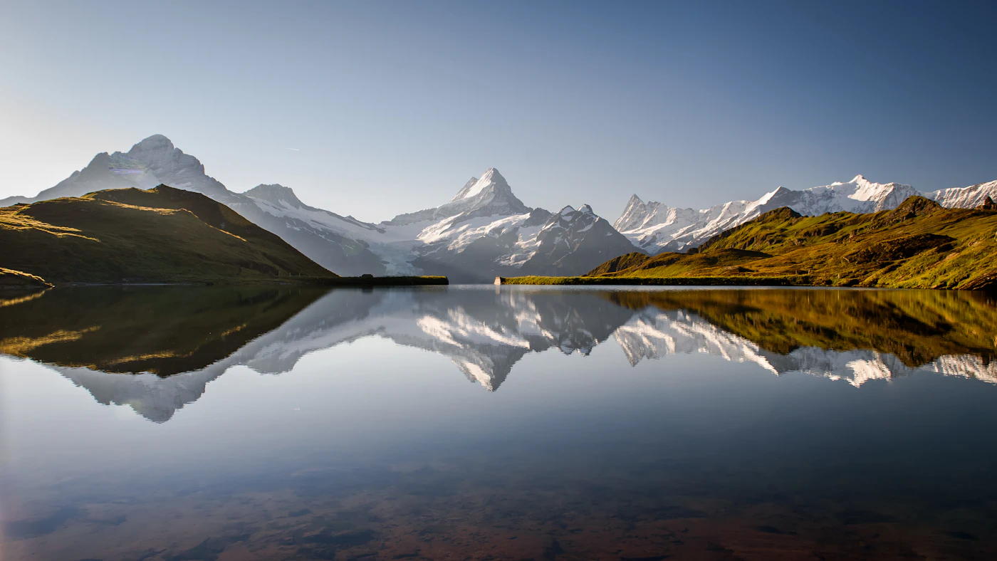 Bachalpsee above Grindelwald with mountains reflected in the lake.