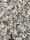 A close-up view of a granite surface with a coarse, speckled pattern. The stone features a mix of black, white, and gray crystals with some pinkish areas, giving it a textured and natural appearance.