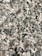 Close-up of a polished granite countertop with natural stone patterns in a modern kitchen.