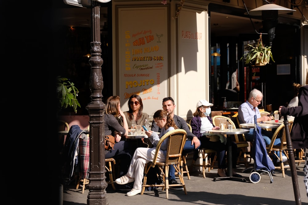 a group of people sitting at tables