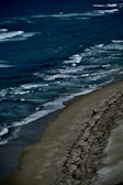 A peaceful beach scene capturing a moment of solitude.