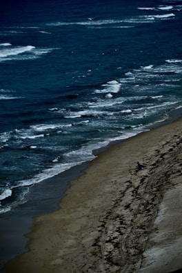 A peaceful beach scene capturing a moment of solitude.