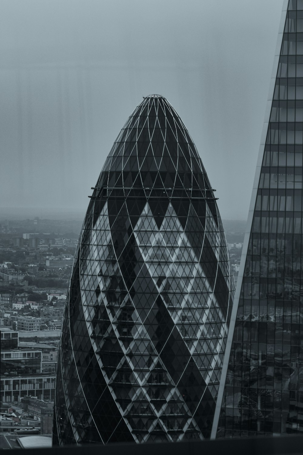 a tall glass building with 30 St Mary Axe in the background
