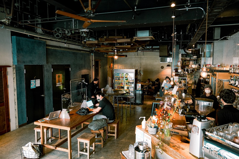 a group of people working in a shop