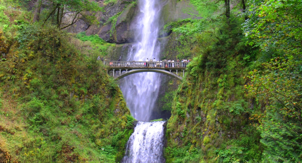 a bridge over a waterfall